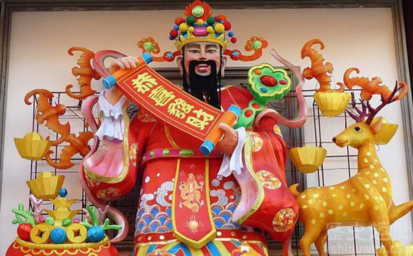 图示：正月初五迎财神，希望财神爷大送红包、金元宝。